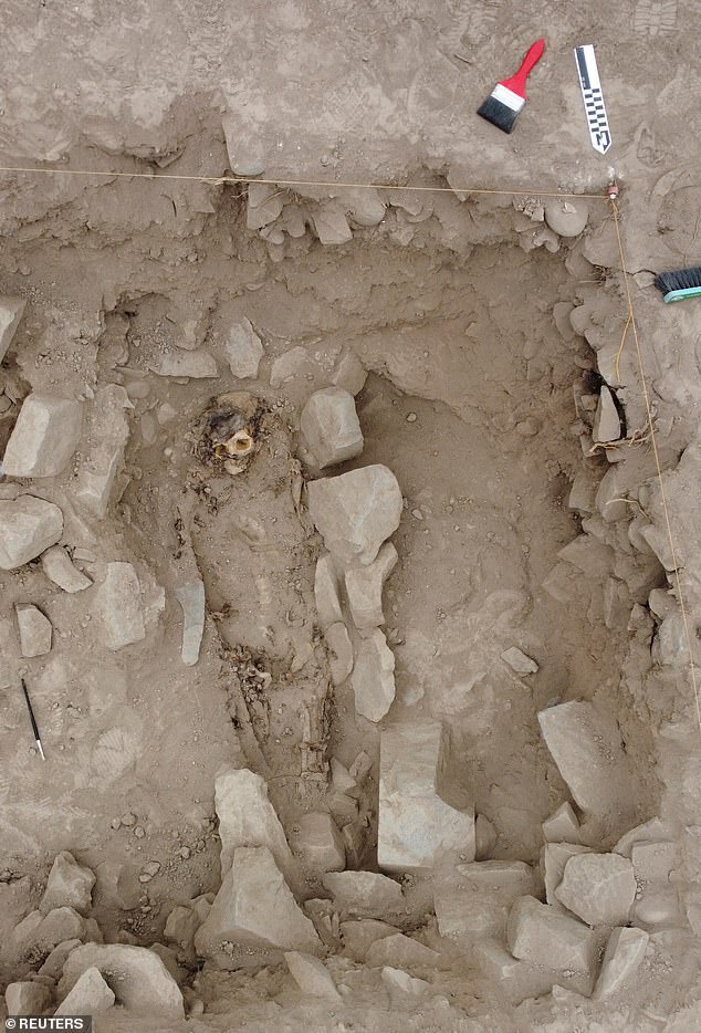 The remains of a mummy, believed to be from the Manchay culture are pictured at the excavation site of a pre-Hispanic burial, in Lima, Peru