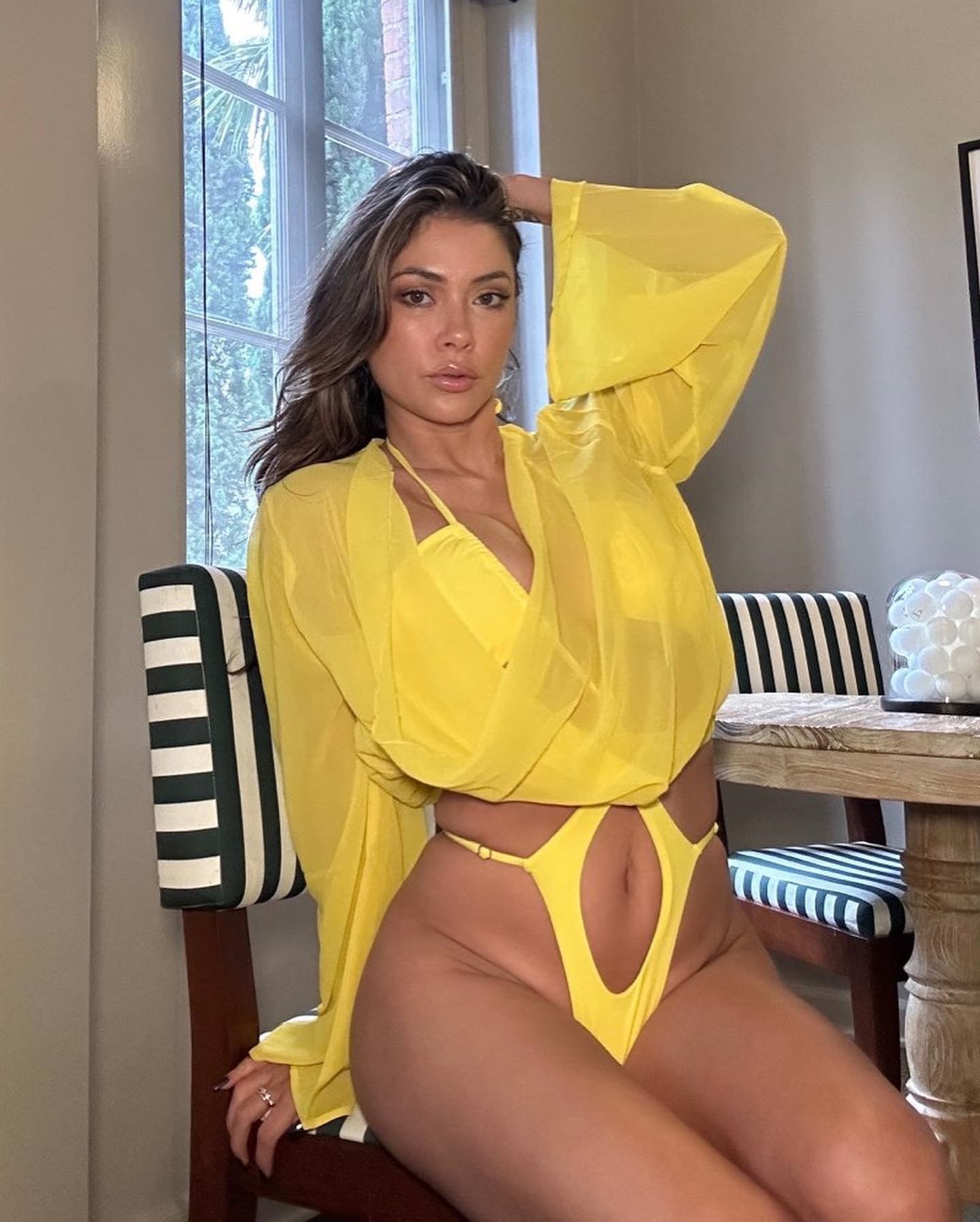 As she posed in yellow lingerie