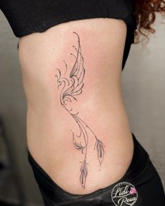 Stunning Rib Tattoos For Women with Meaning - mysteriousevent.com