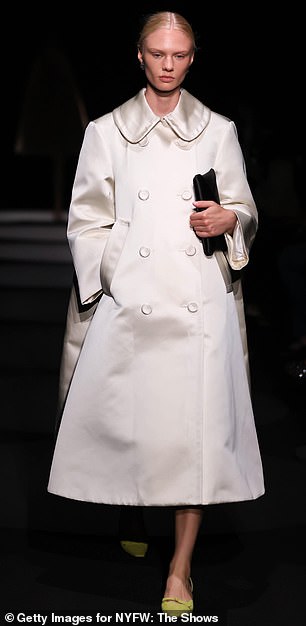 Fashionable: Another opted for a stark white overcoat that was paired with lime green high-heeled shoes