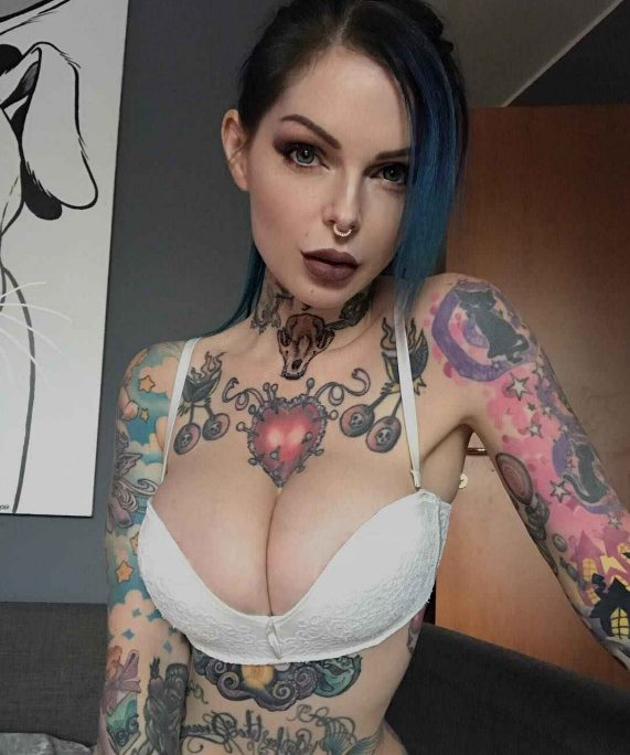 Explore the unique beauty of Riae's tattoos and be mesmerized by her captivating body art! - amazingtoday.net