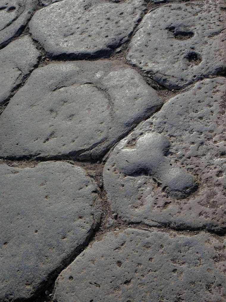 A penis carved into the road of Pompeii, pointing to the nearest brothel.