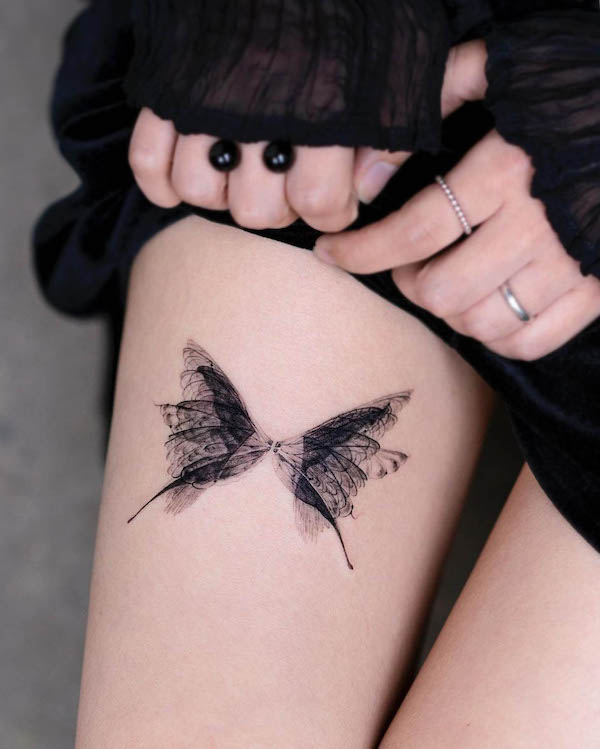 Translucent butterfly thigh tattoo by @pokhy_tattoo