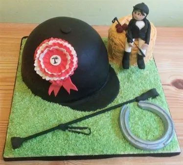 Horse riding equipment cake with hat, rider, horseshoes, and whip