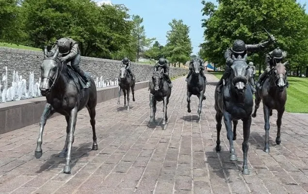 The Track at Thoroughbred Park. Statues of racehorses racing