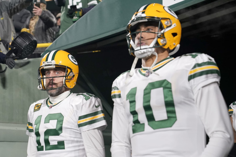 GREEN BAY, WISCONSIN - NOVEMBER 17: Aaron Rodgers #12 and Jordan Love #10 of the Green Bay Packers look on prior to the game against the Tennessee Titans at Lambeau Field on November 17, 2022 in Green Bay, Wisconsin. (Photo by Patrick McDermott/Getty Images)