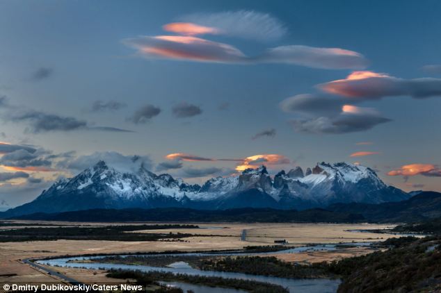 Eerie: The rare cloud formations are often mistaken for UFOs because of their saucer-like shape and orange glow