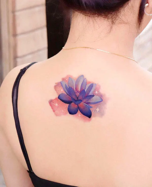 Watercolor lotus back tattoo by @peria_tattoo