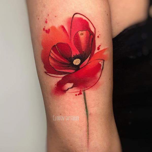 Watercolor poppy back of arm tattoo