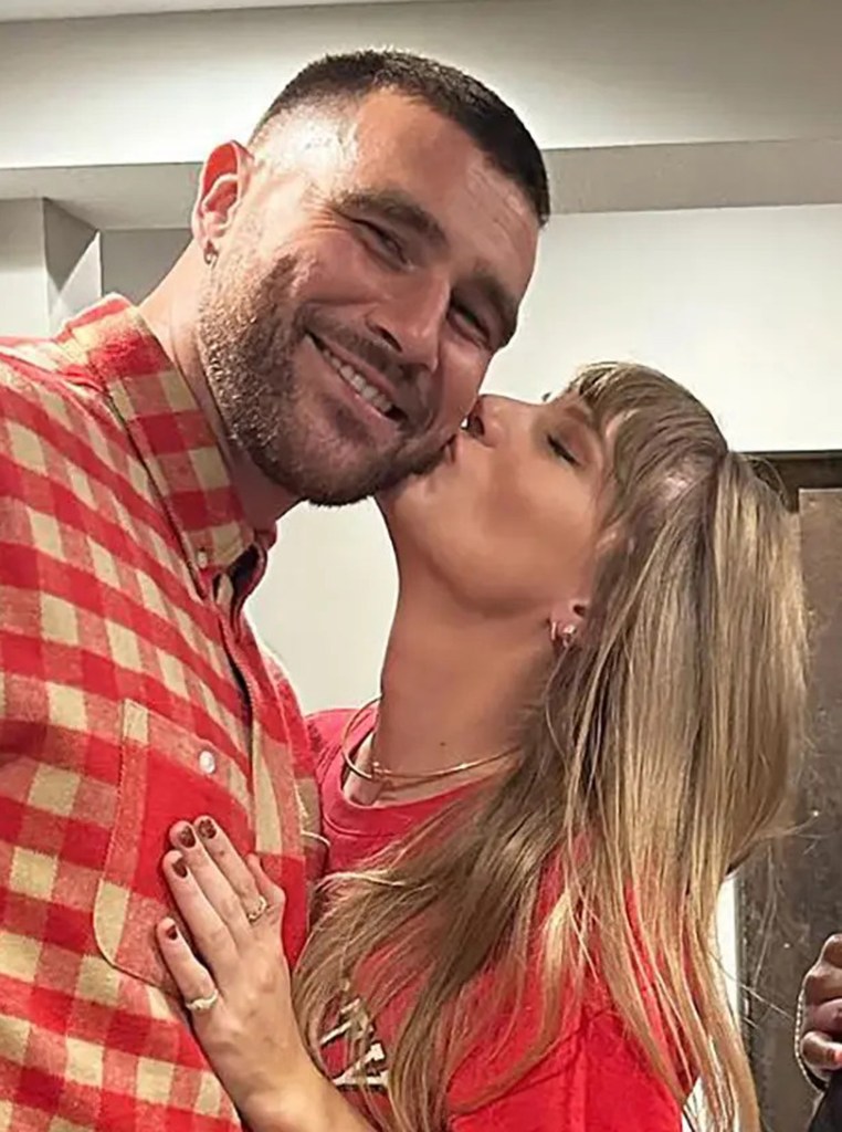 Taylor Swift kisses travis kelce's cheek as he smiles at the camera