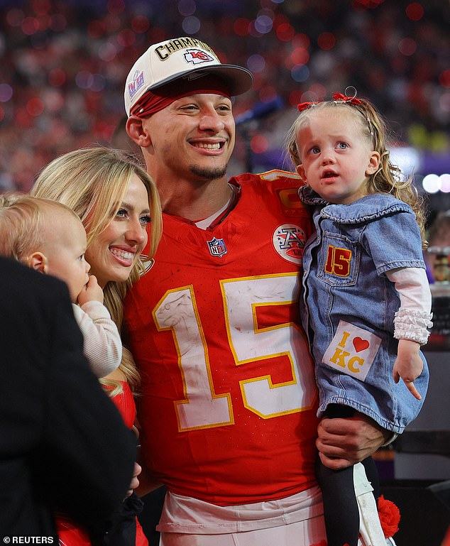 Brittany and Patrick with Sterling and Bronze on the field after the big win