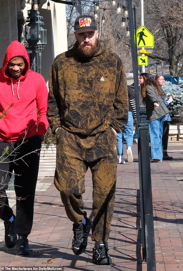 Kelce wore matching brown patterned sweatpants and hoodie complete with black sneakers