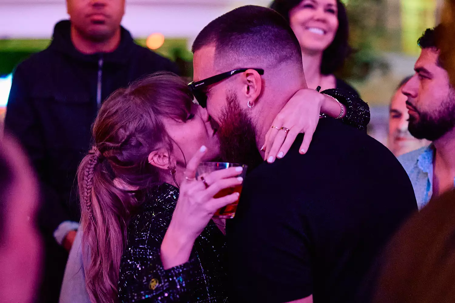 Taylor Swift and Travis Kelce Share Celebratory Kiss inside DJ Booth at XS Nightclub inside Wynn Las Vegas on Feb. 11