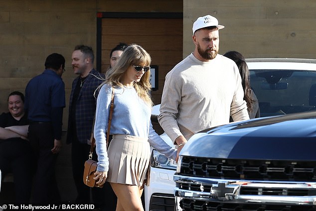 She further accessorized the look with a chic brown bag and black sunglasses