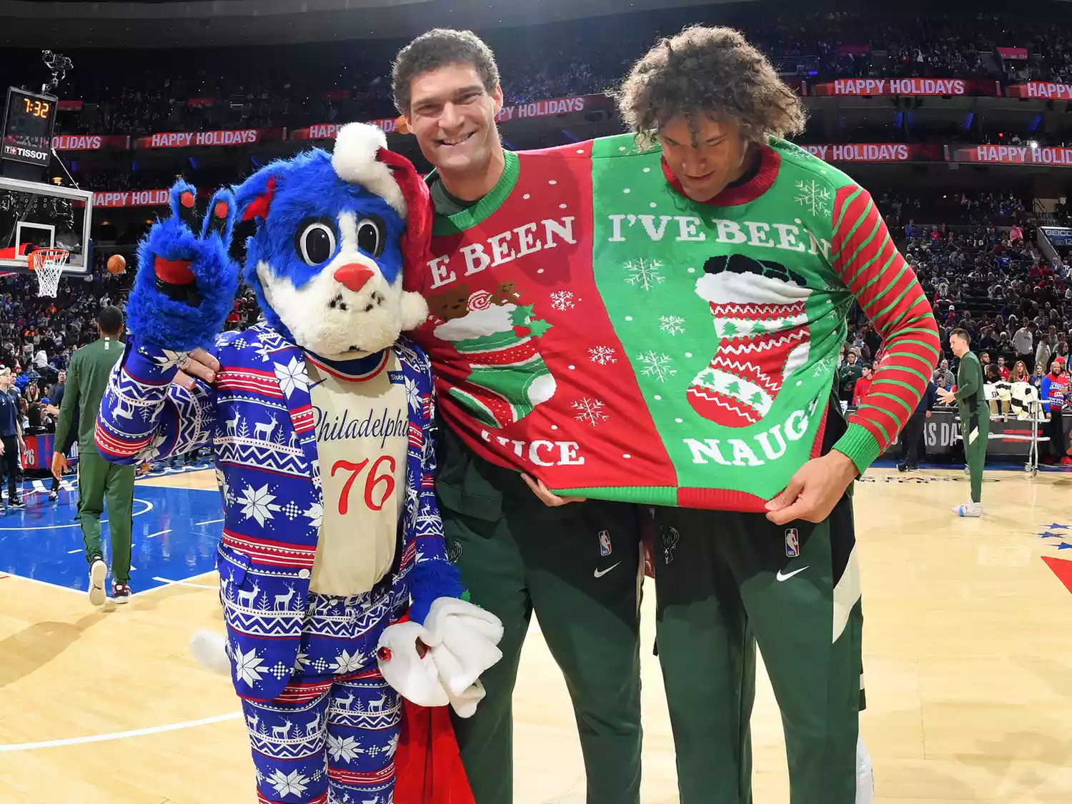 Brook Lopez and Robin Lopez pose for a photo before the game against the Philadelphia 76ers on December 25, 2019 in Philadelphia, Pennsylvania.