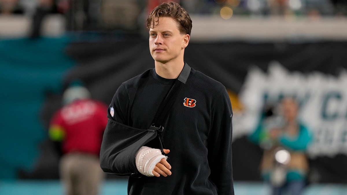 Cincinnati Bengals quarterback Joe Burrow takes the field to watch his team practice before facing the Jacksonville Jaguars at Everbank Stadium in Jacksonville, Florida