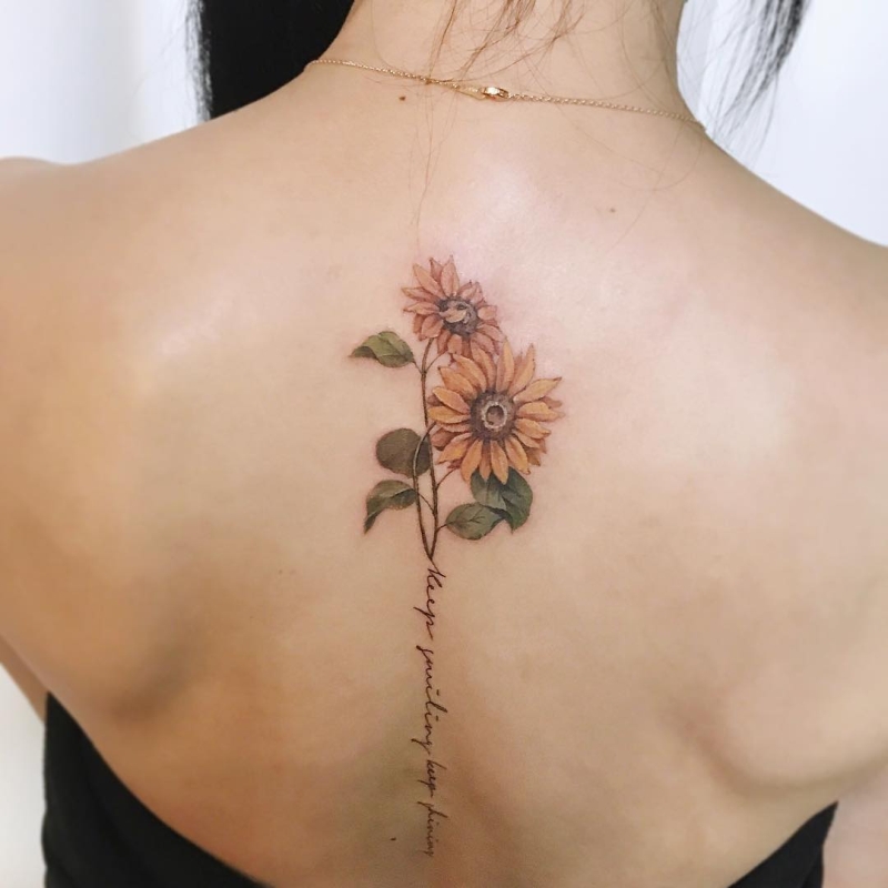 beautiful spine sunflower tattoo by tattooist ara