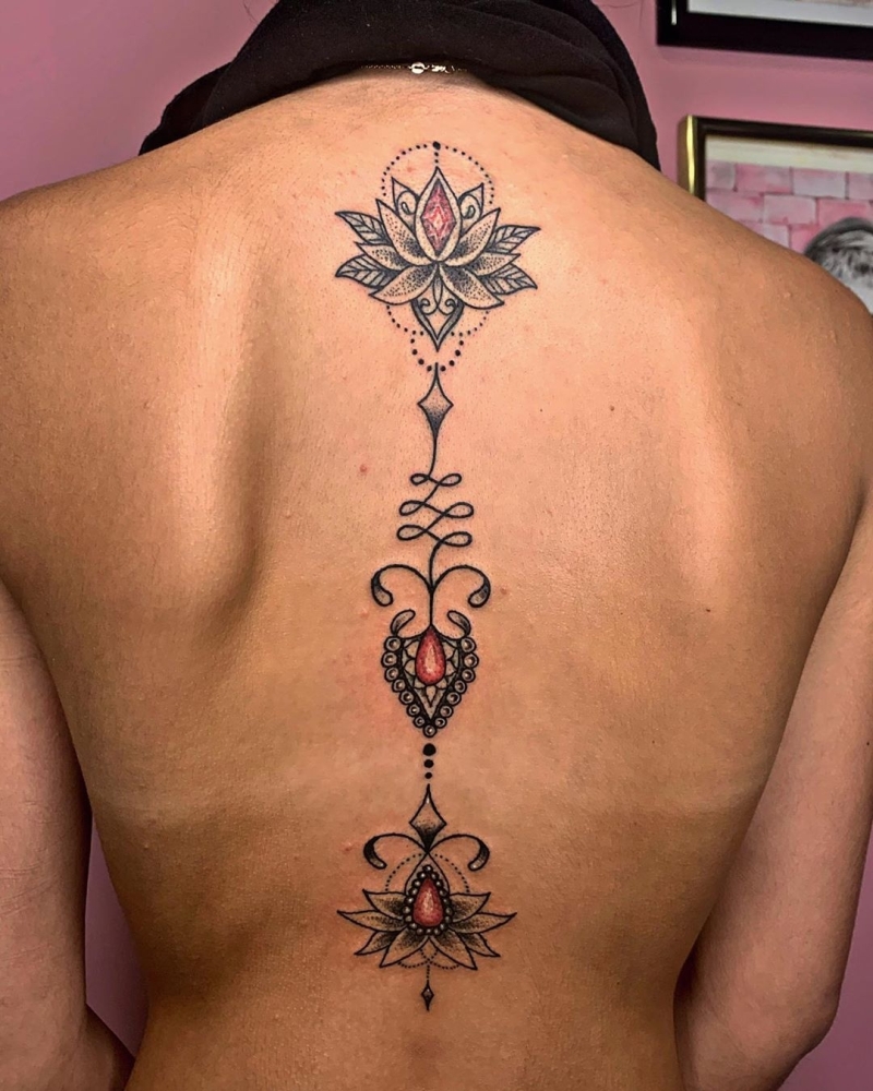 cool lotus tattoos on spine @kasey.tattoos 2