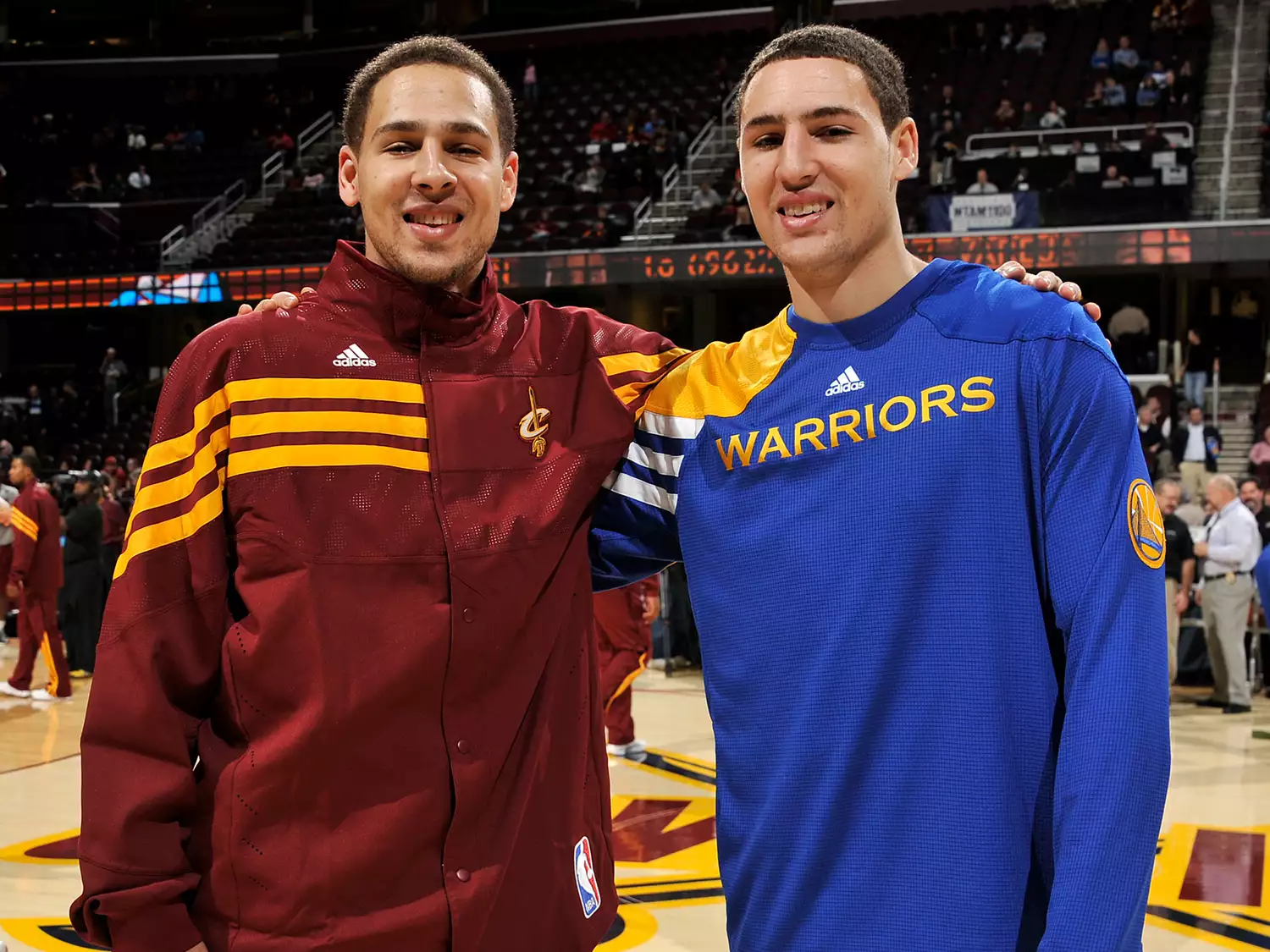 Mychel Thompson #21 of the Cleveland Cavaliers stands alongside his brother Klay Thompson #11 of the Golden State Warriors at The Quicken Loans Arena on January 17, 2012 in Cleveland, Ohio.