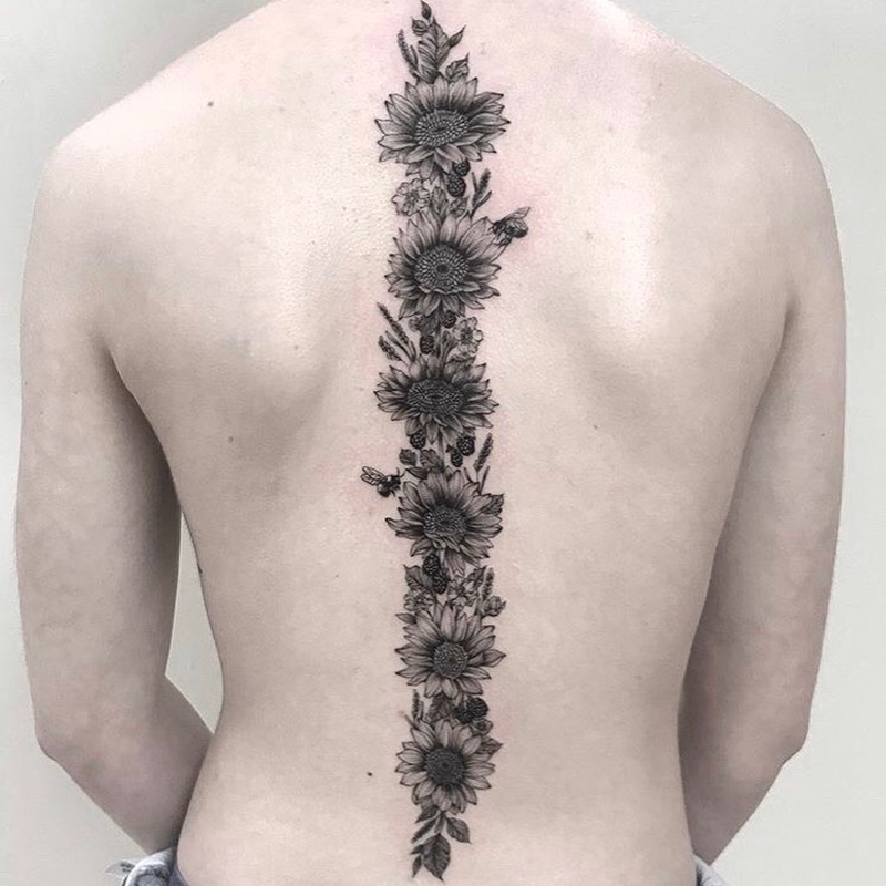 sunflower spine tattoo idea @queenbeetattooandsalon 3