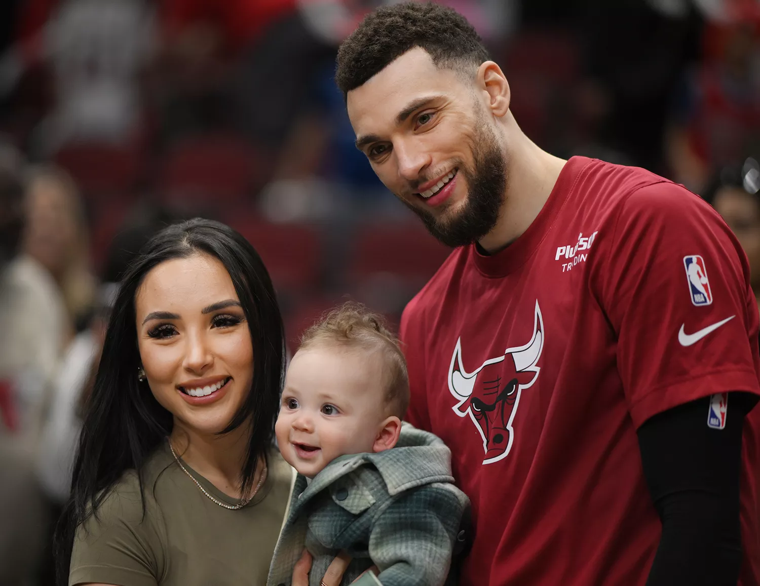 Hunter, Saint, and Zach LaVine #8 of the Chicago Bulls pose for a photo after the game against the Detroit Pistons at United Center on April 09, 2023