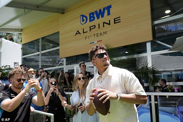 He wore a watch on one wrist and a bracelet on the other and put black sunglasses on his face