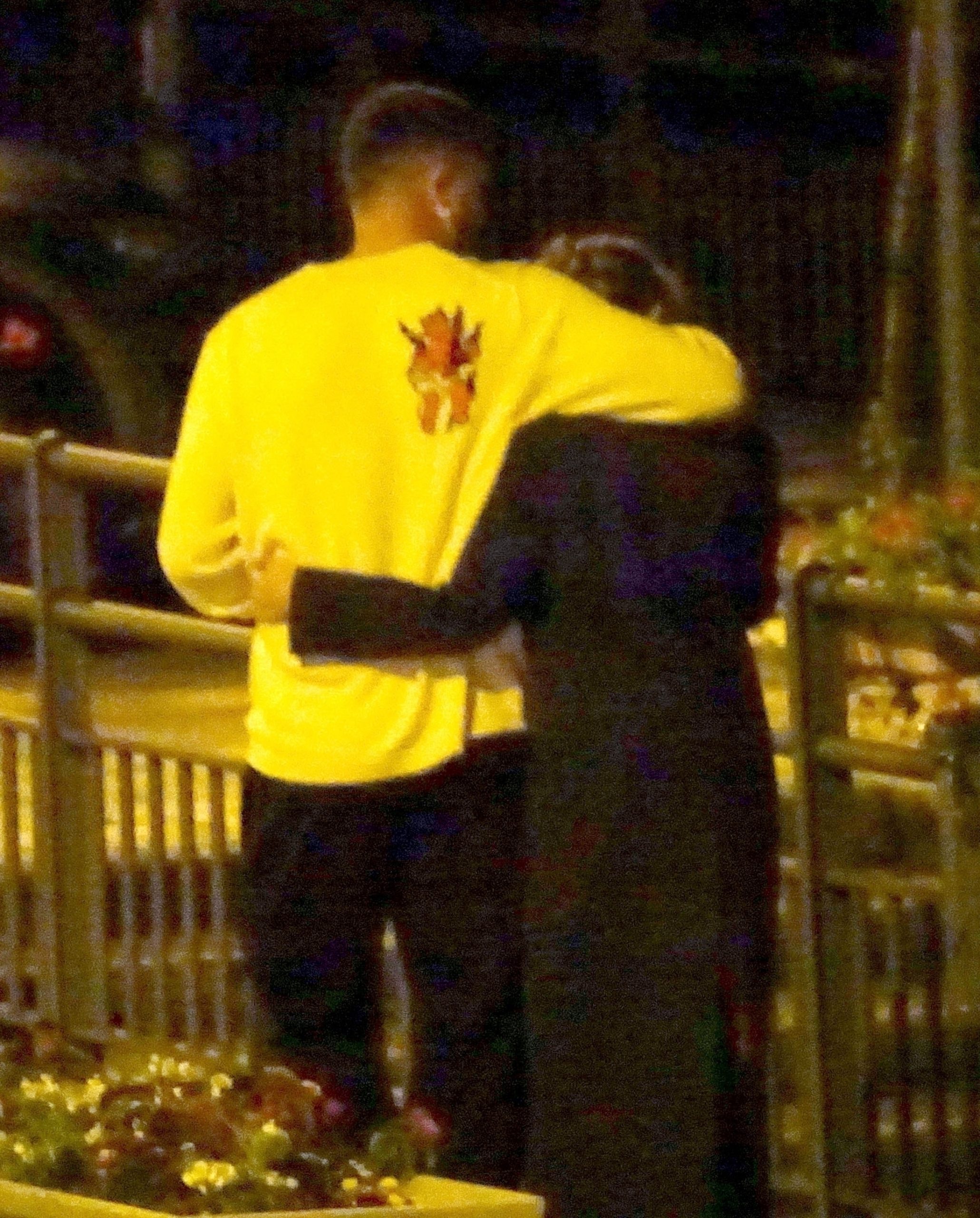 Taylor and Travis were spotted holding each other during their night stroll in Lake Como