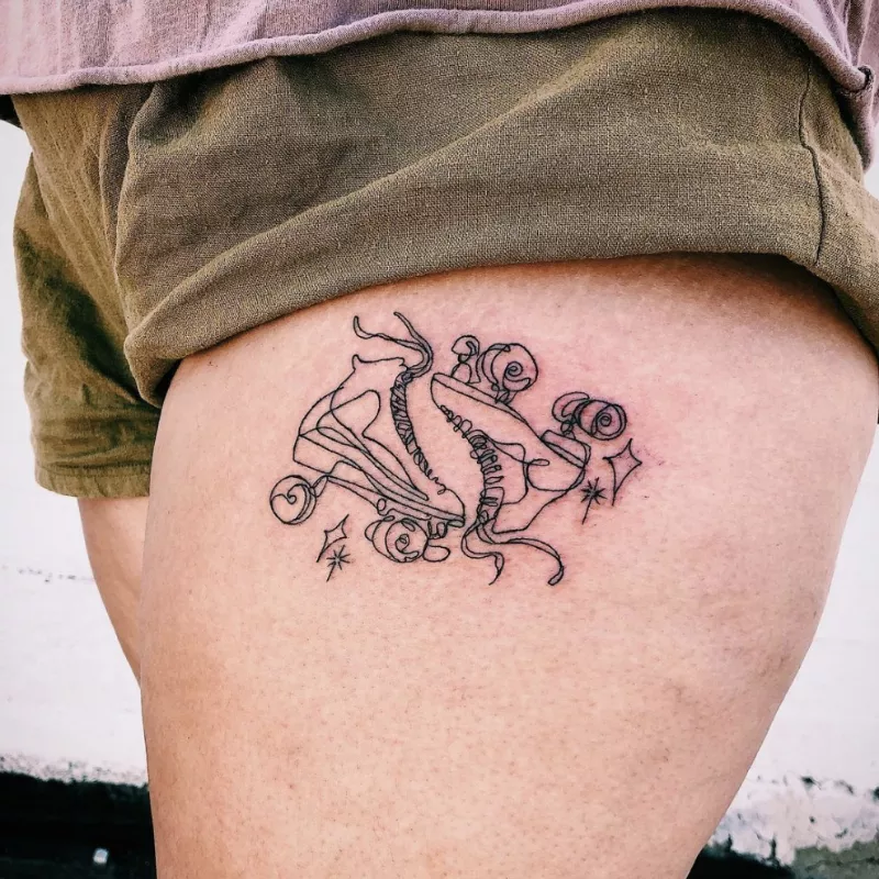 roller skates thigh tattoo