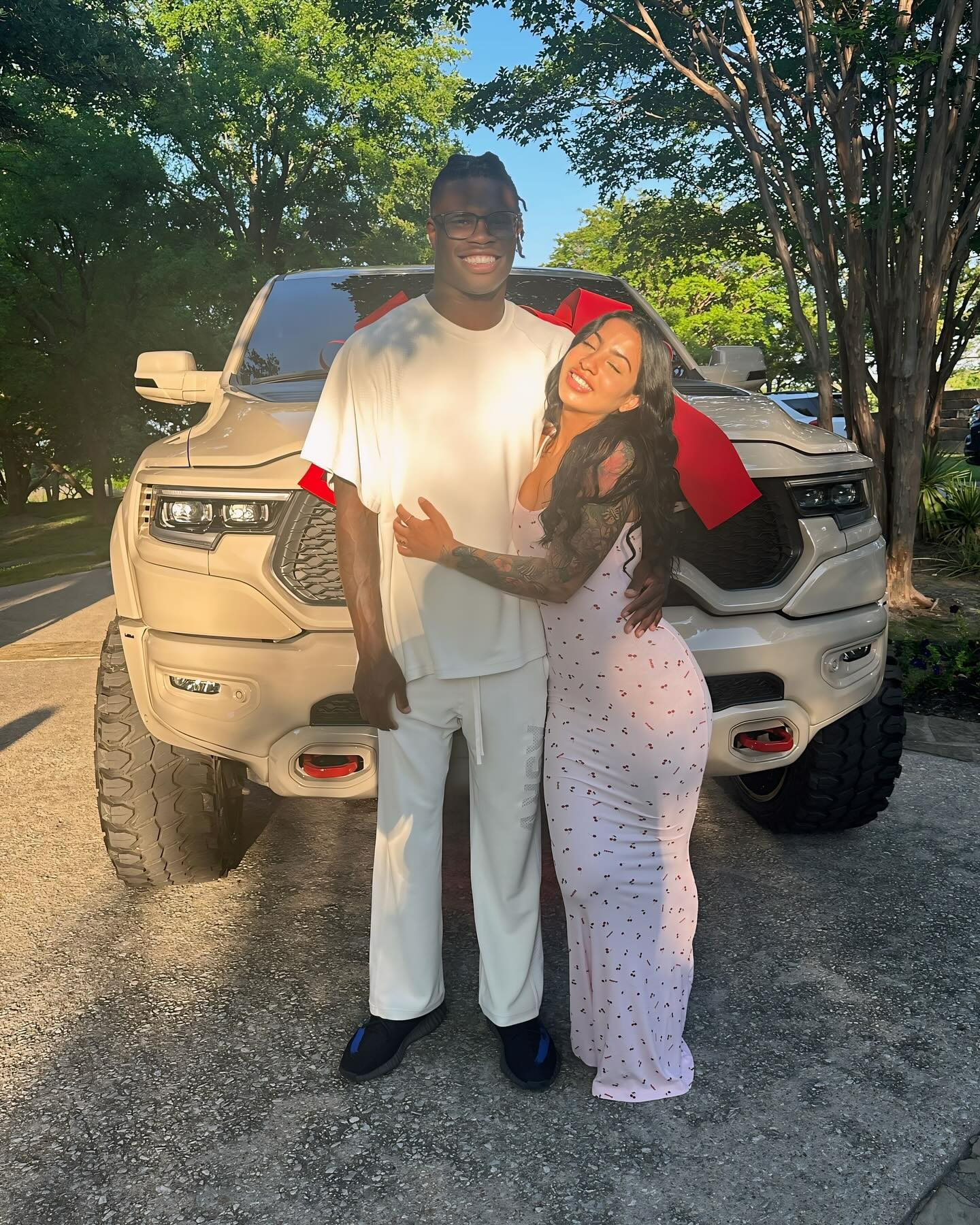 Travis Hunter shows off new truck with fiancee Leanna