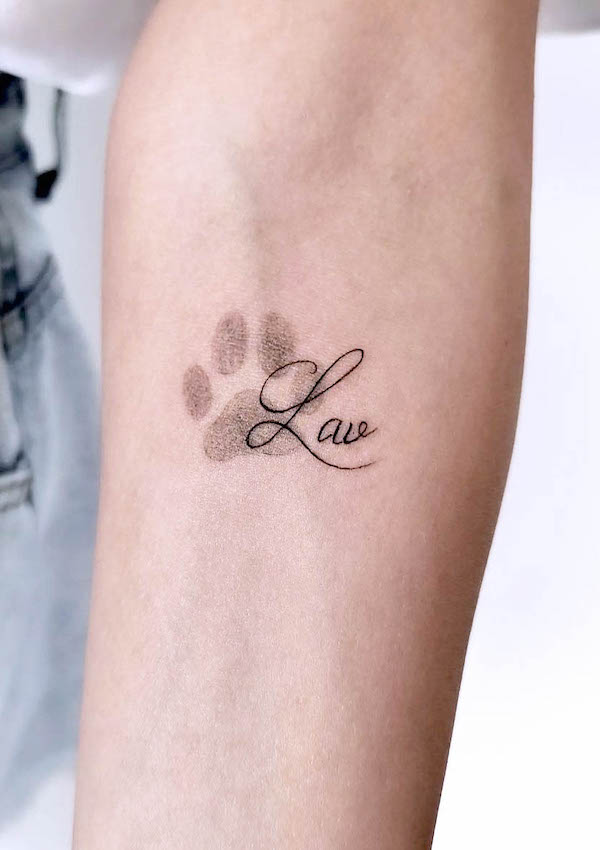Dog paw prints tattoo by @tattooivek