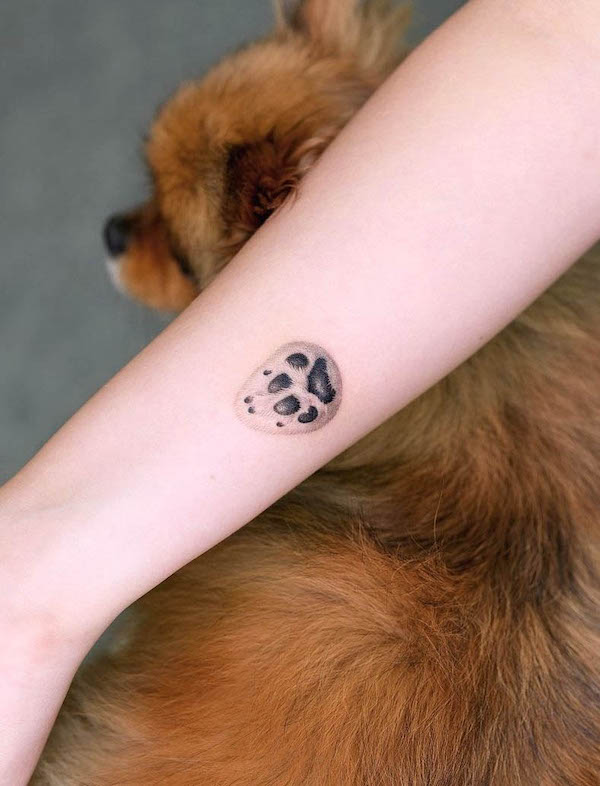 Small dog paw tattoo by @zeal_tattoo