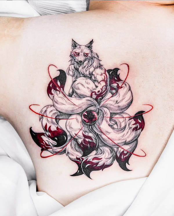 Stunning ruby nine-tailed fox tattoo by @nolgida.tattoo