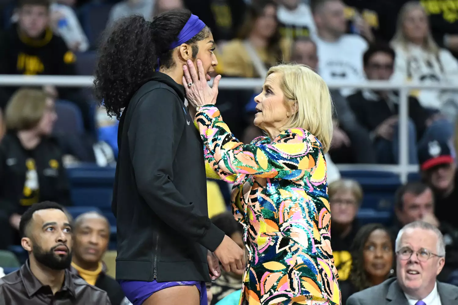 Angel Reese #10 of the LSU Lady Tigers speaks with head coach Kim Mulkey of the LSU Lady Tigers on the sidelines during a game against the UCLA Bruins during the Sweet Sixteen round of the 2024 NCAA Women's Basketball Tournament held at MVP Arena on March 30, 2024 in Albany, New York.