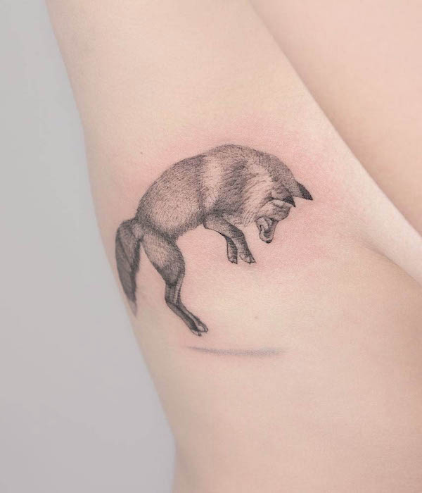 Realistic jumping fox tattoo by @kalawa.tattooer