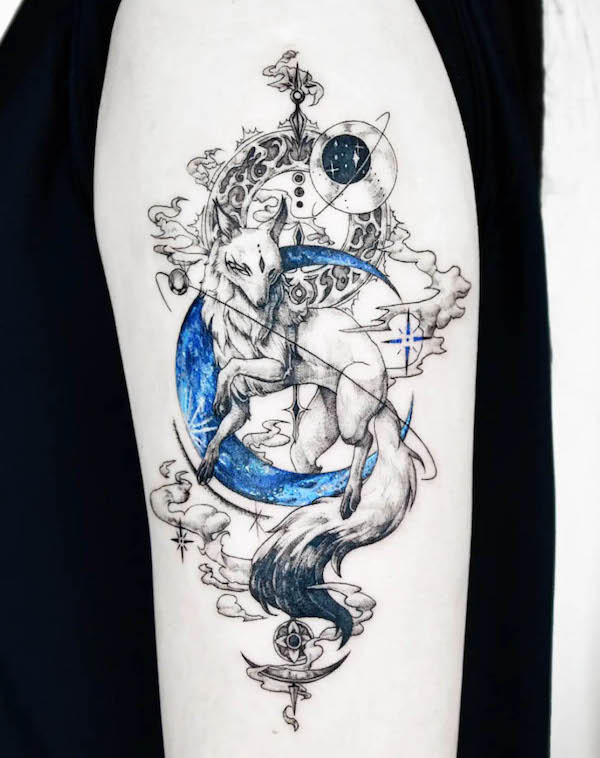 Intricate blue moon and fox tattoo by @nolgida.tattoo