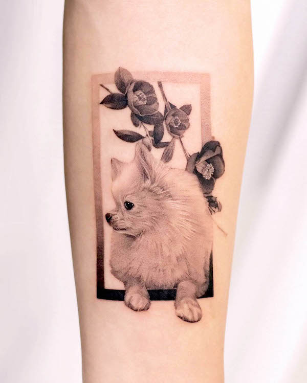 Dog and camellia tattoo by @start.your.line