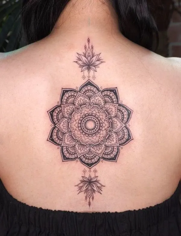 Sophisticated mandala back tattoo by @niki___niki___niki