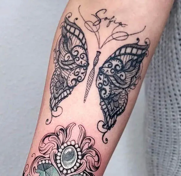 Mandala butterfly arm tattoo by @melli_ink