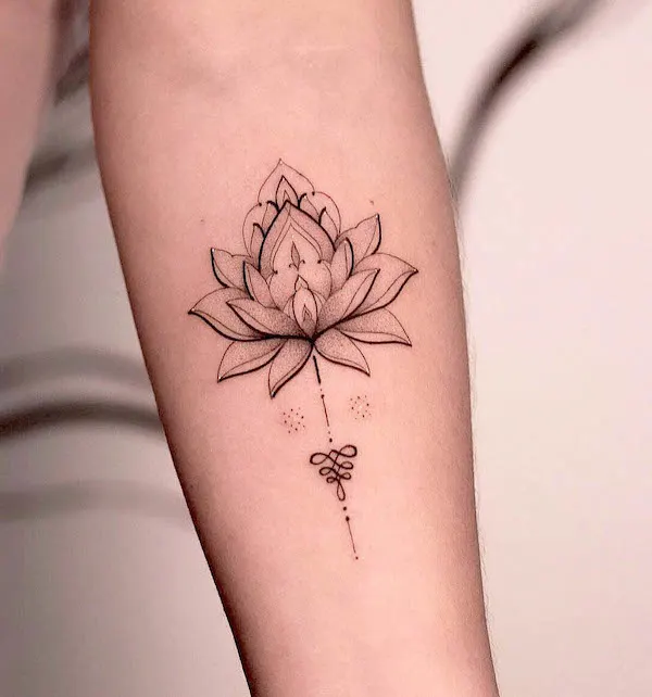 Simple fine line lotus tattoo by @toytattoo