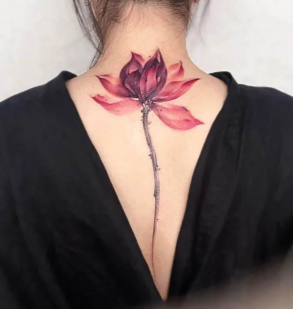 Bold color lotus spine tattoo by @iriss_tattoo