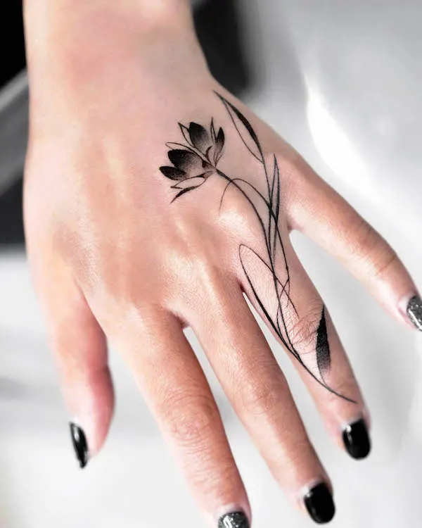 Lotus flower hand tattoo by @mukyeon_tattoo
