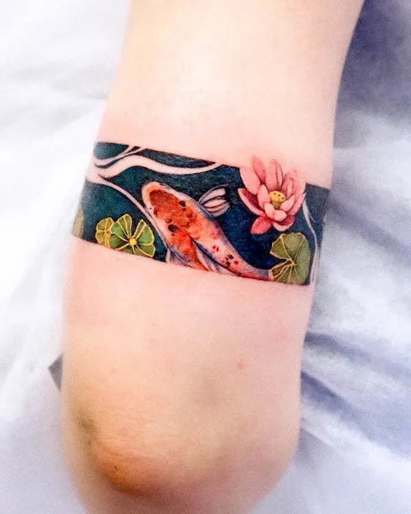 Koi fish and lotus tattoo by @yshiww