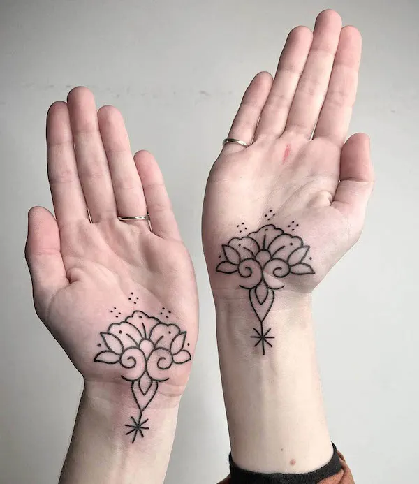 Matching lotus palm tattoos by @sherinmariemavi