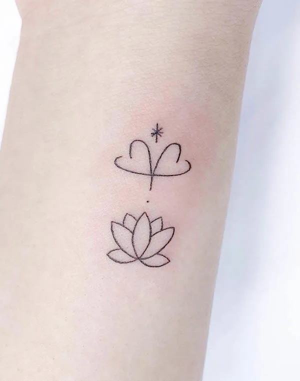 Simple Aries and lotus symbol by @simbar_tattoo