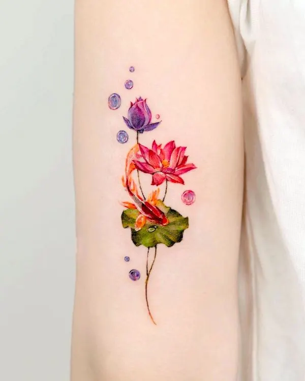 Koi fish and lotus tattoo by @tilda_tattoo