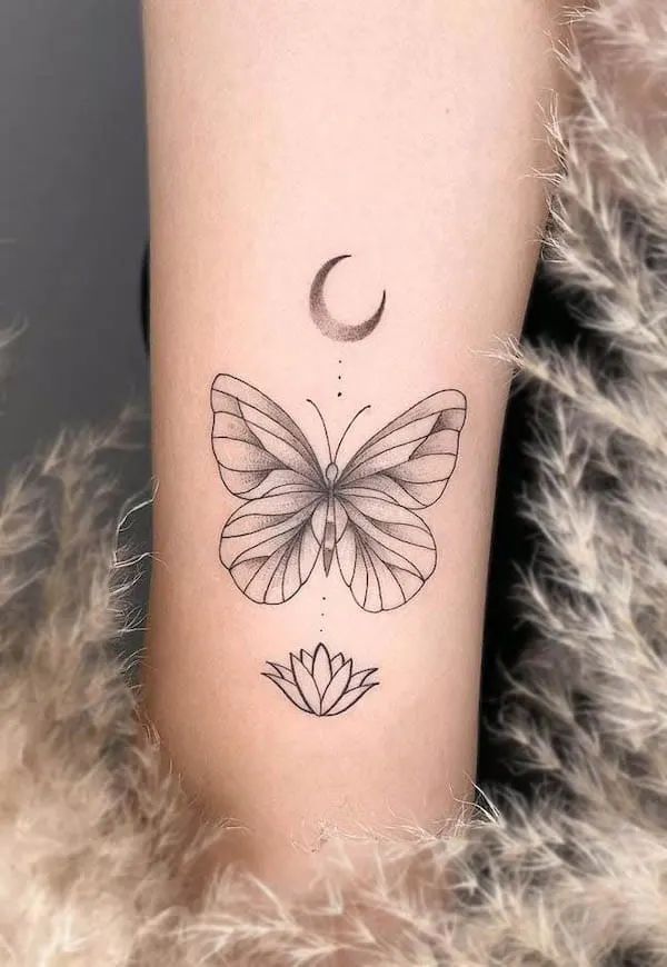 Lunar butterfly and lotus tattoo by @ladnie.ink
