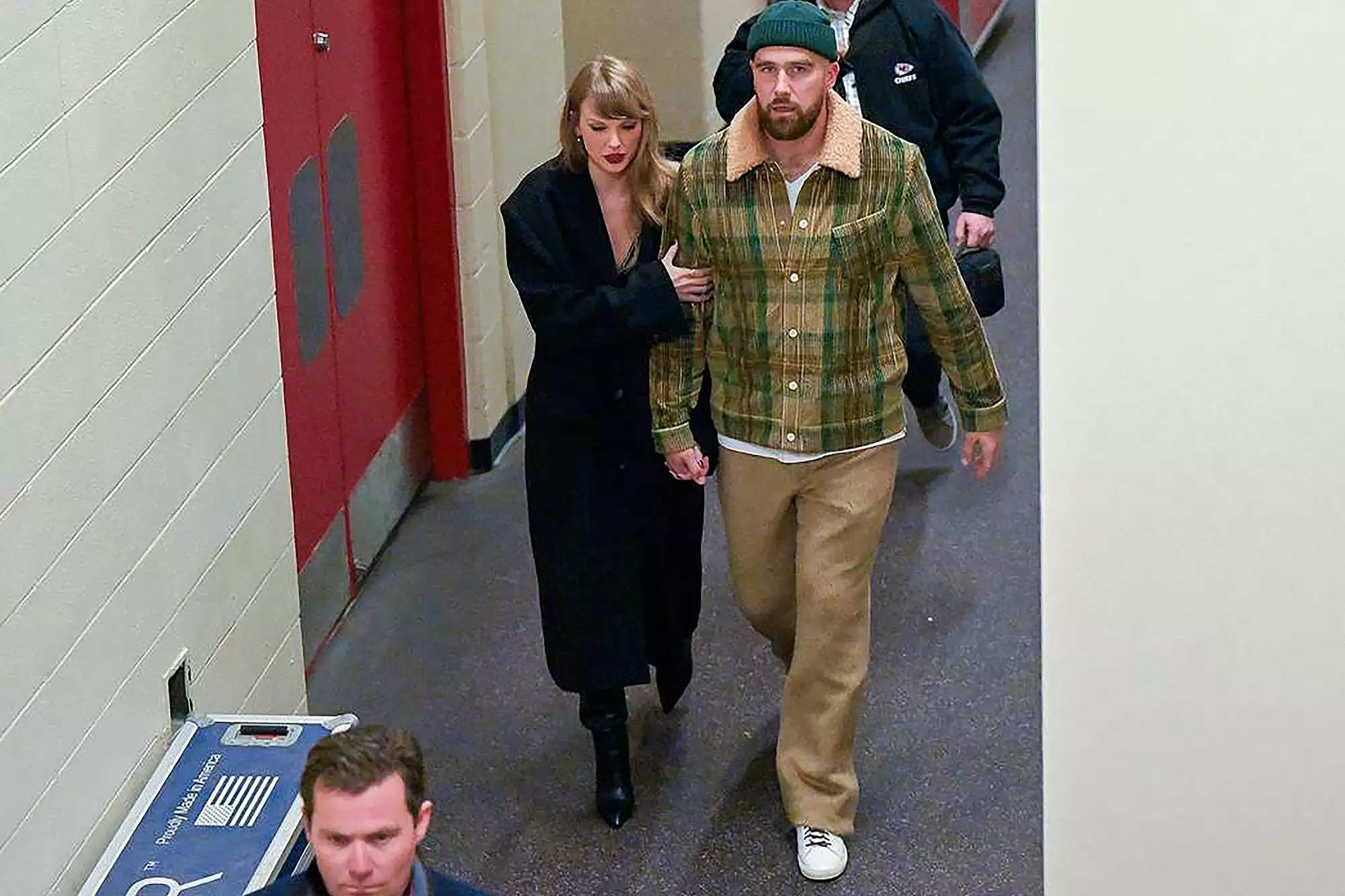 Taylor Swift, left, and Travis Kelce leave after the Buffalo Bills defeated the Kansas City Chiefs, 20-17, on Dec. 10, 2023, at GEHA Field at Arrowhead Stadium in Kansas City, Missouri