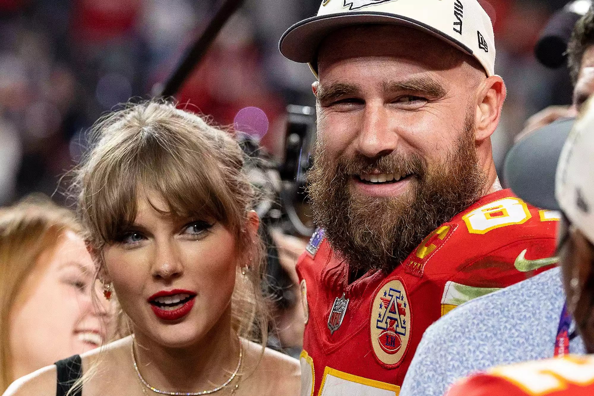 LAS VEGAS, NEVADA - FEBRUARY 11: Travis Kelce #87 of the Kansas City Chiefs and Taylor Swift react as they see Mecole Hardman Jr. #12 of the Kansas City Chiefs following the NFL Super Bowl 58 football game between the San Francisco 49ers and the Kansas City Chiefs at Allegiant Stadium on February 11, 2024 in Las Vegas, Nevada.