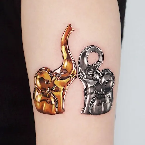 Gold and silver elephants by @jooa_tattoo