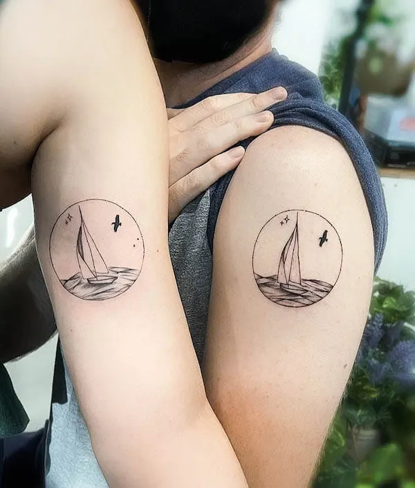 Matching boat tattoos on the arm by @wayneyslc